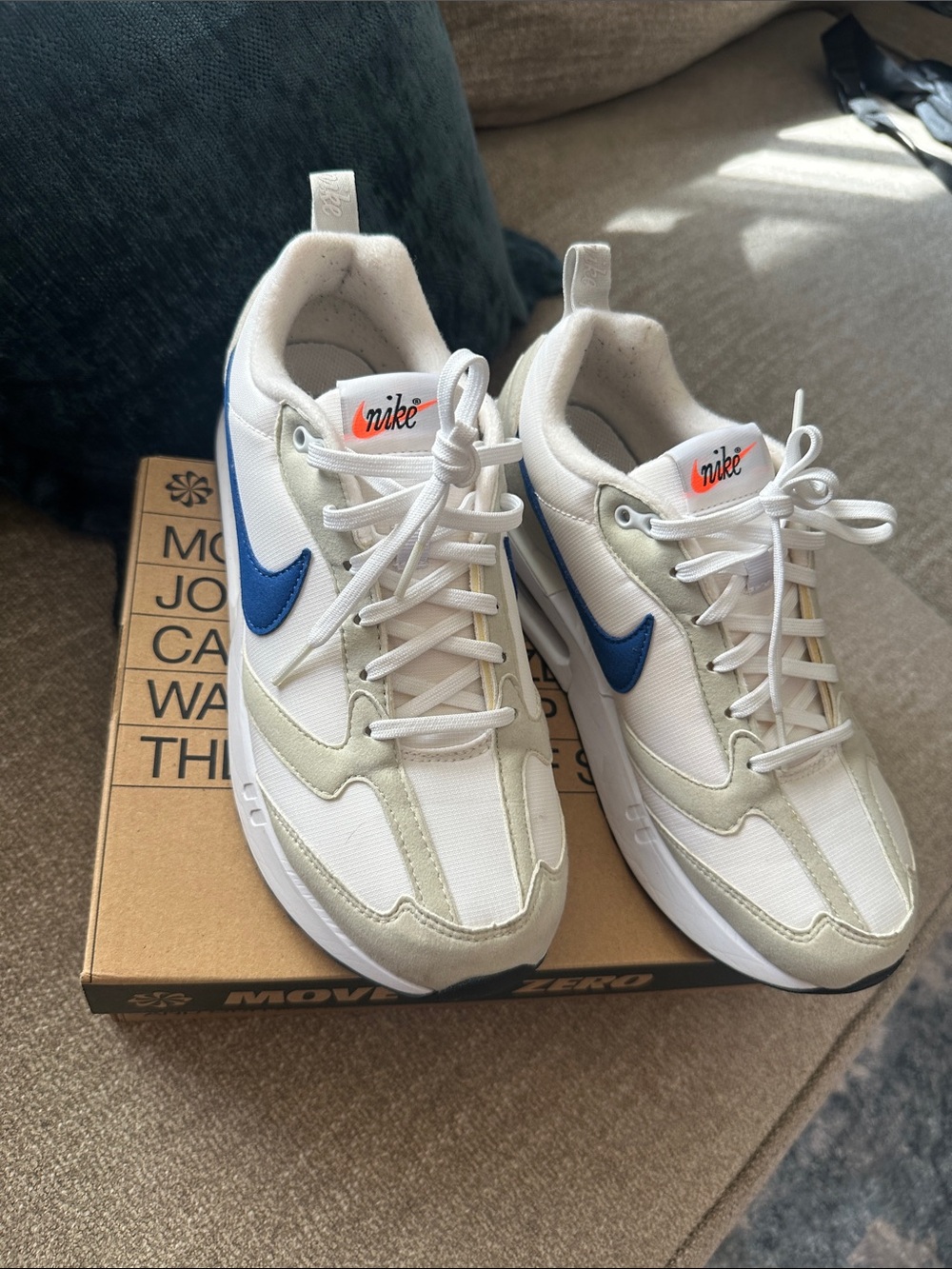 Nike Kids White Sneakers with Blue Swoosh and Cream Accents
